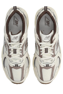 New balance unisex sneaker beige with white and brown mesh uppers suede accents and chunky rubber sole for running
