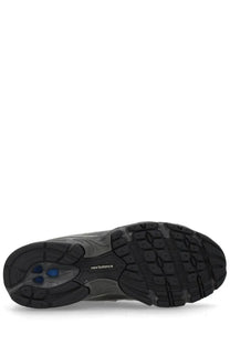 New balance unisex sneaker black with textured rubber sole and blue accent details visible on the side