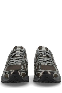 New Balance unisex sneaker black in dark brown and silver mesh with a glossy black rubber sole