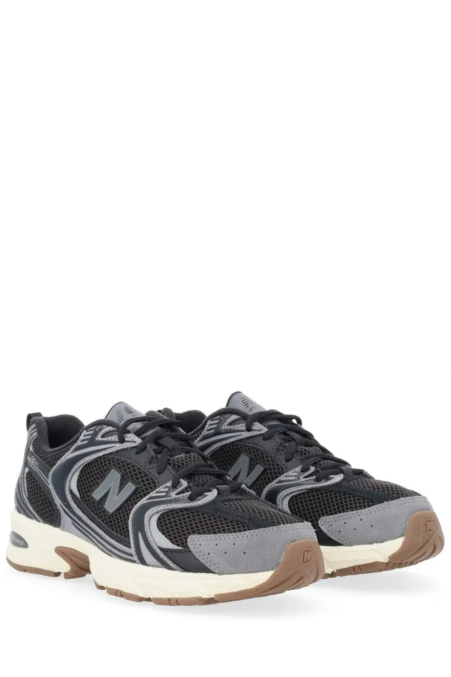 New Balance unisex sneaker black with black and gray mesh upper suede overlays and tan rubber sole