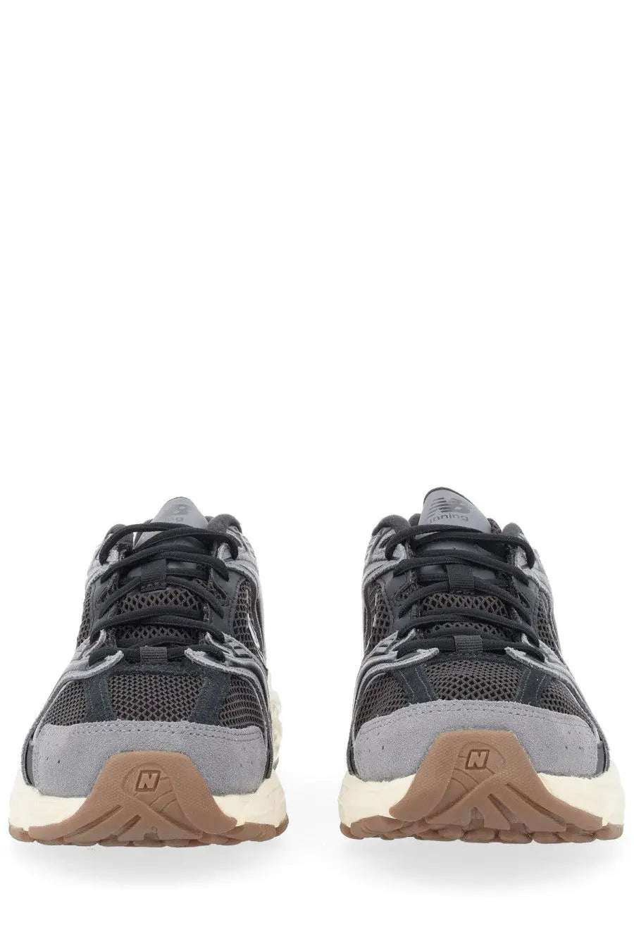 New balance unisex sneaker black with black and gray mesh upper and tan rubber sole featuring classic design