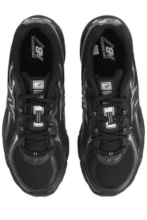 New balance unisex sneaker black with mesh upper and glossy black accents perfect for running and casual wear