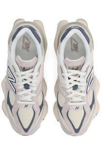 New balance unisex sneaker grey featuring cream and navy blue chunky retro-inspired design for casual wear