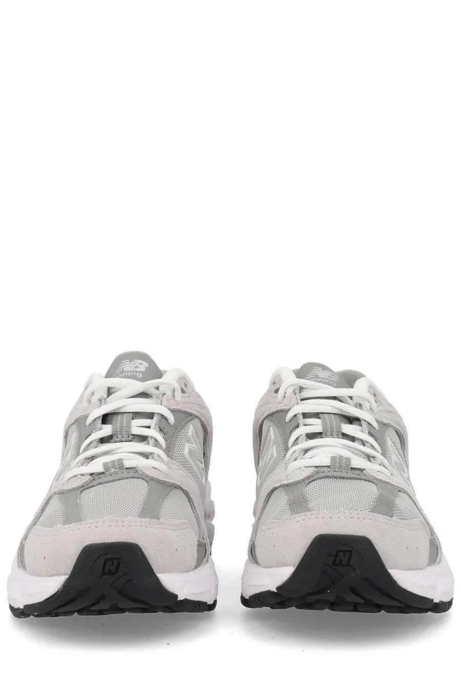 New Balance unisex sneaker grey with gray and white mesh upper, rubber outsole, and black heel branding