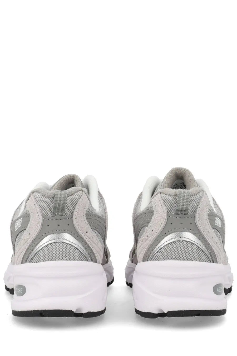 New Balance unisex sneaker grey with gray and white mesh and synthetic overlays and silver metallic heel accent