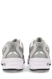 New Balance unisex sneaker grey featuring gray and white mesh and synthetic overlays with silver metallic heel accent