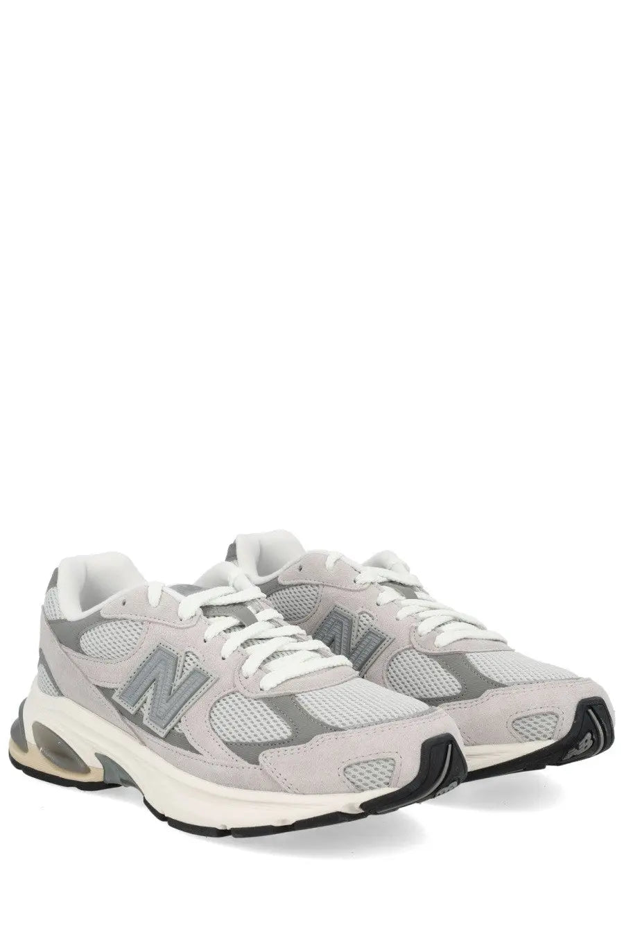 New Balance unisex sneaker grey featuring light gray mesh and suede upper with white laces and translucent air heel unit
