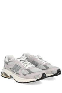 New Balance unisex sneaker grey featuring light gray mesh and suede upper with white laces and translucent air heel unit