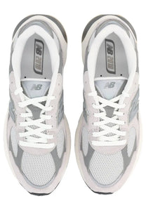 New Balance unisex sneaker grey with silver and white mesh uppers and rubber soles for comfortable wear