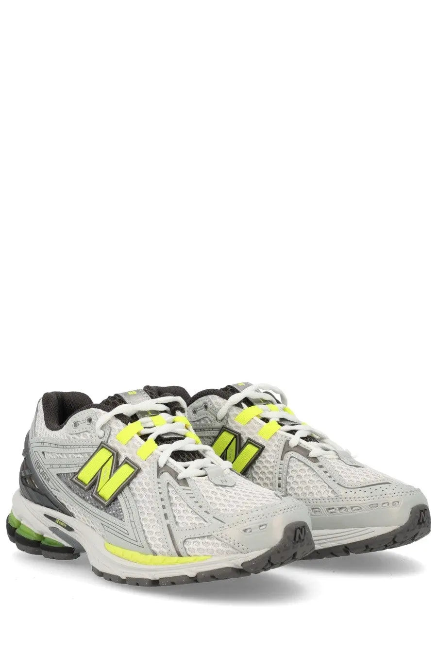 New balance unisex sneaker u1906r grey featuring white and neon yellow mesh upper with black accents and cushioned sole