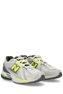 New balance unisex sneaker u1906r grey featuring white and neon yellow mesh upper with black accents and cushioned sole