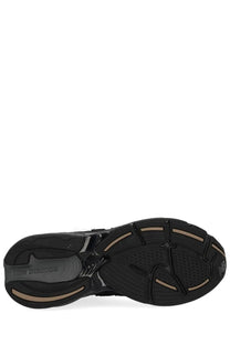 New Balance unisex sneaker U2010 black with matte finish and tan accent stripes on the rubber sole