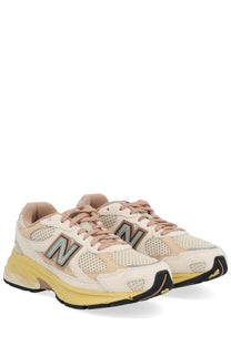 New Balance unisex sneaker U2010 in cream and beige mesh with bold yellow midsole and black outsole accents