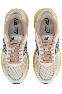 New Balance unisex sneaker U2010 multicolor in cream and beige with mesh uppers suede accents and chunky yellow midsole