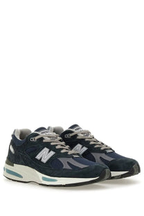 New Balance unisex sneaker U991 blue navy suede and mesh with gray laces silver logo and teal midsole details