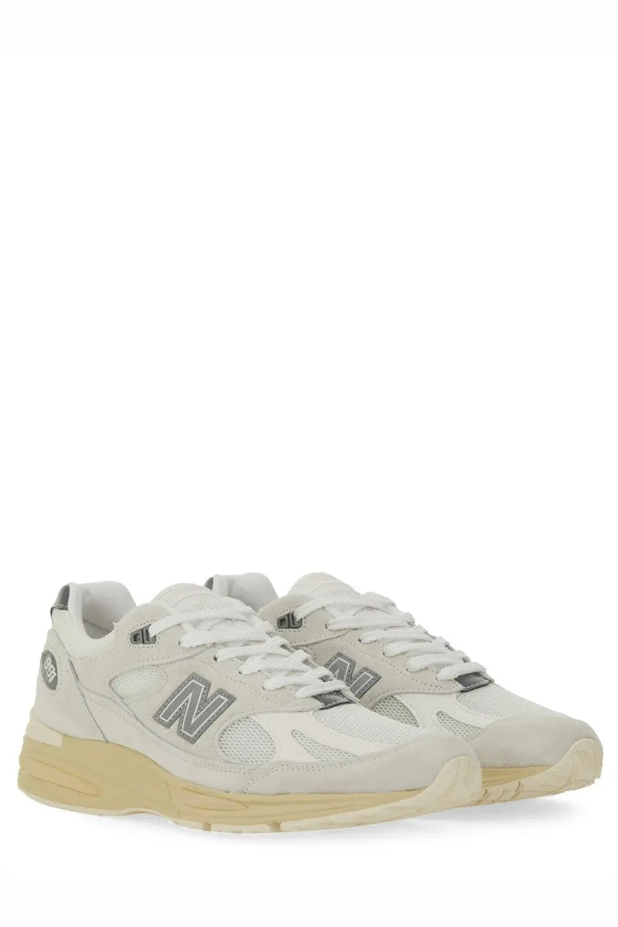 Cream-colored new balance unisex sneaker u991 white with suede and mesh upper gray logo accents and beige rubber sole