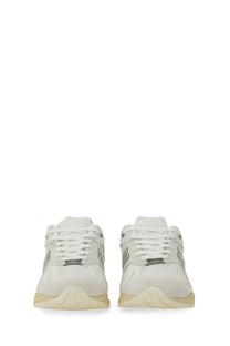 New Balance unisex sneaker U991 white with silver accents and cream-colored sole in a stylish athletic design