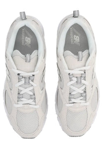 New balance unisex sneaker white featuring white 990v4 mesh and synthetic overlays with a classic retro design
