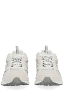 New Balance unisex sneaker white with white and gray mesh panels and rubber soles in a sleek modern design