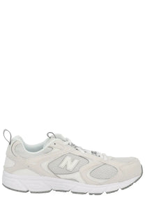 New balance unisex sneaker in light gray with mesh and synthetic upper white laces and cushioned sole