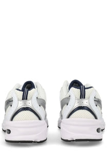 New Balance unisex sneaker white with white and silver mesh upper navy blue accents and durable rubber sole