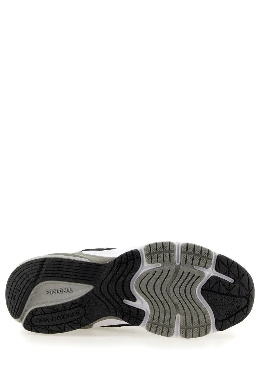 New Balance women’s sneaker 990v6 black with black and gray running shoe and textured rubber outsole visible from the back