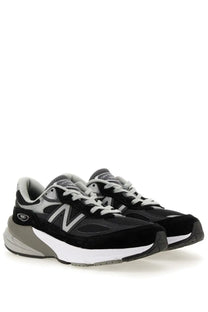 New Balance women’s sneaker 990v6 in black with mesh and suede upper white midsole and silver n logo