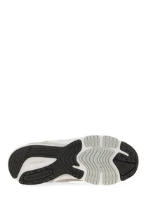 Black and white rubber sole with wavy tread on new balance women’s grey sneaker for enhanced traction