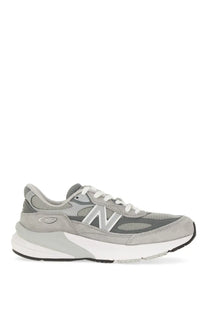 New balance women’s sneaker grey featuring a gray mesh and suede upper with white laces and chunky white midsole