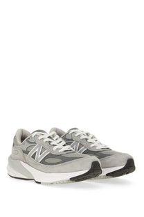 New balance women’s sneaker grey featuring gray suede and mesh with white laces and black rubber outsole