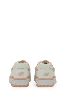New Balance women’s sneaker white in cream with blush pink accents and chunky white sole for casual wear