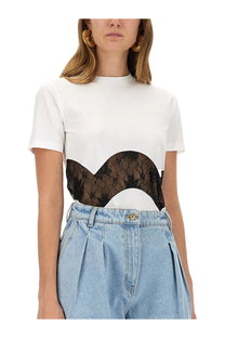 Nina Ricci women’s white jersey t-shirt with short sleeves and a black lace panel across the midsection