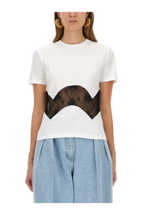 Nina Ricci women’s white jersey shirt with short sleeves and bold black lace floral panel across midsection