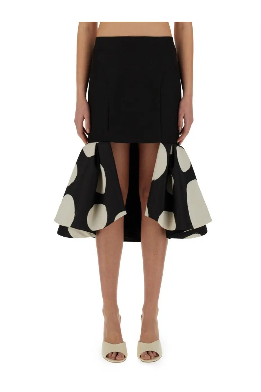Black high-waisted Nina Ricci women’s midi skirt with a flared asymmetrical hem and large cream polka dots