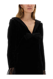 Nina Ricci women’s black velvet mini dress with sailor collar, matching bow, and lace-trimmed cuffs