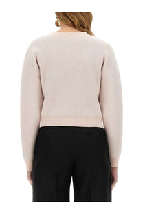 Nina Ricci women’s mohair cardigan in beige shown as a soft blush pink cropped knit sweater with ribbed hems and cuffs