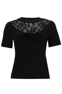Nina Ricci women’s black short-sleeved shirt with intricate lace shoulders and matching bow at neckline