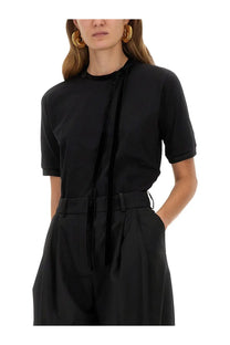 Nina Ricci women’s black short-sleeved shirt with velvet tie details at the neckline and waist