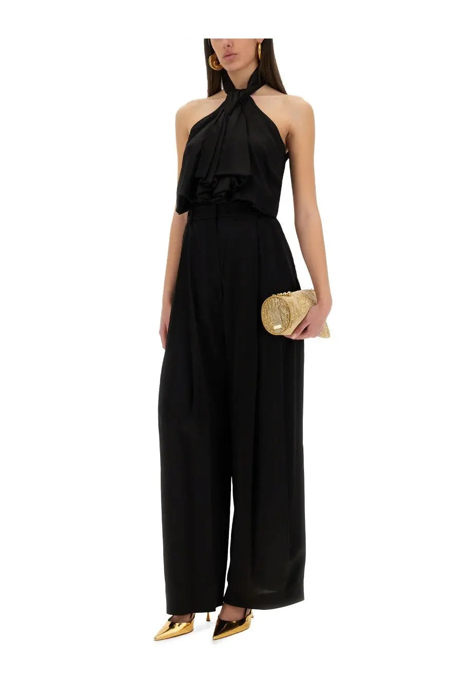 Black halter neck jumpsuit with ruffled neckline and wide leg pants by Nina Ricci for women’s fashion