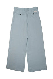 Light blue wide-leg trousers with clean minimalist design and subtle buttoned back pockets by Nine Inthe Morning