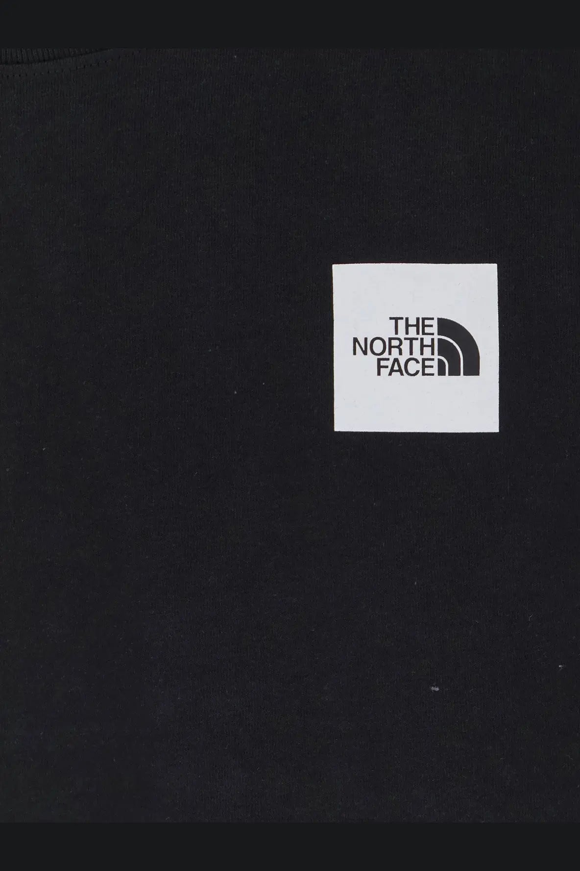 The North Face men’s black cotton t-shirt with a white square logo featuring black text and arc design on the front