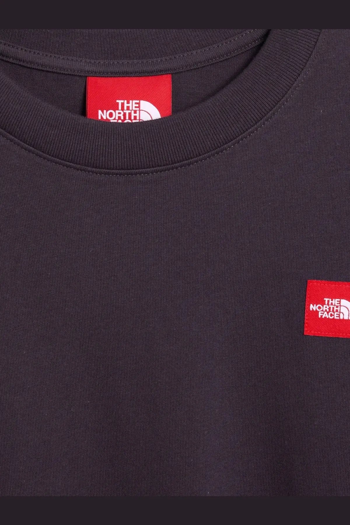 The North Face men’s black cotton crewneck sweatshirt with red rectangular logo patches and white text detail