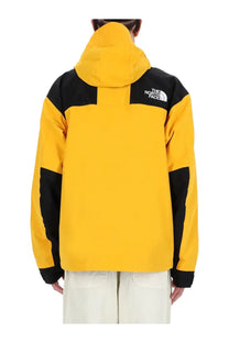 The north face men’s dryvent jacket yellow in yellow and black with hood and contrasting panels on shoulders sleeves and cuffs