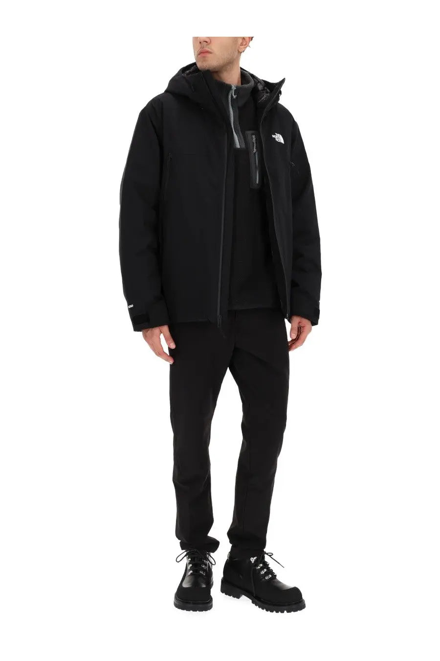 The North Face men’s black jacket with a hood and zipper closure designed for outdoor use