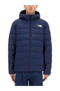 The North Face men’s navy blue puffer jacket with quilted design and white logo on chest