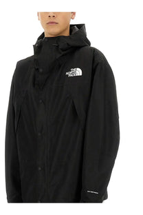 Black the north face men’s mountain jacket with hood white logo and button closures