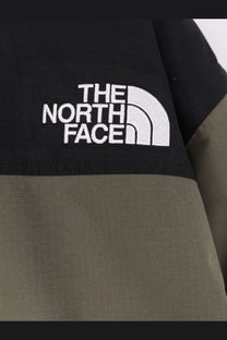The North Face men’s mountain down jacket in black and olive green with a white embroidered logo on the sleeve