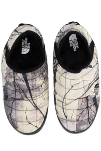 The north face men’s mule shoe thermoball grey slip-on features a quilted white and black tree branch pattern with black rubber soles
