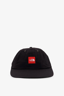 Black the north face men’s nylon baseball cap with red square logo patch on the front