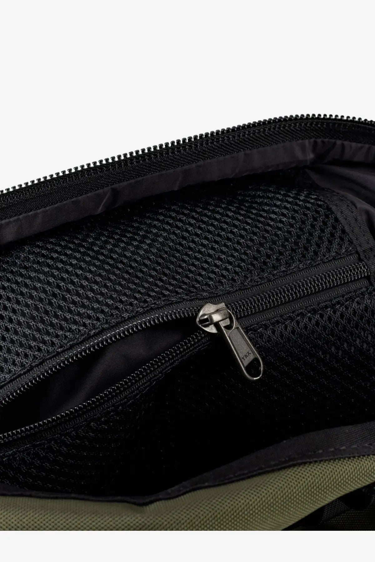 The north face men’s beige nylon shoulder bag with black mesh-lined interior and black zipper with metallic pull tab